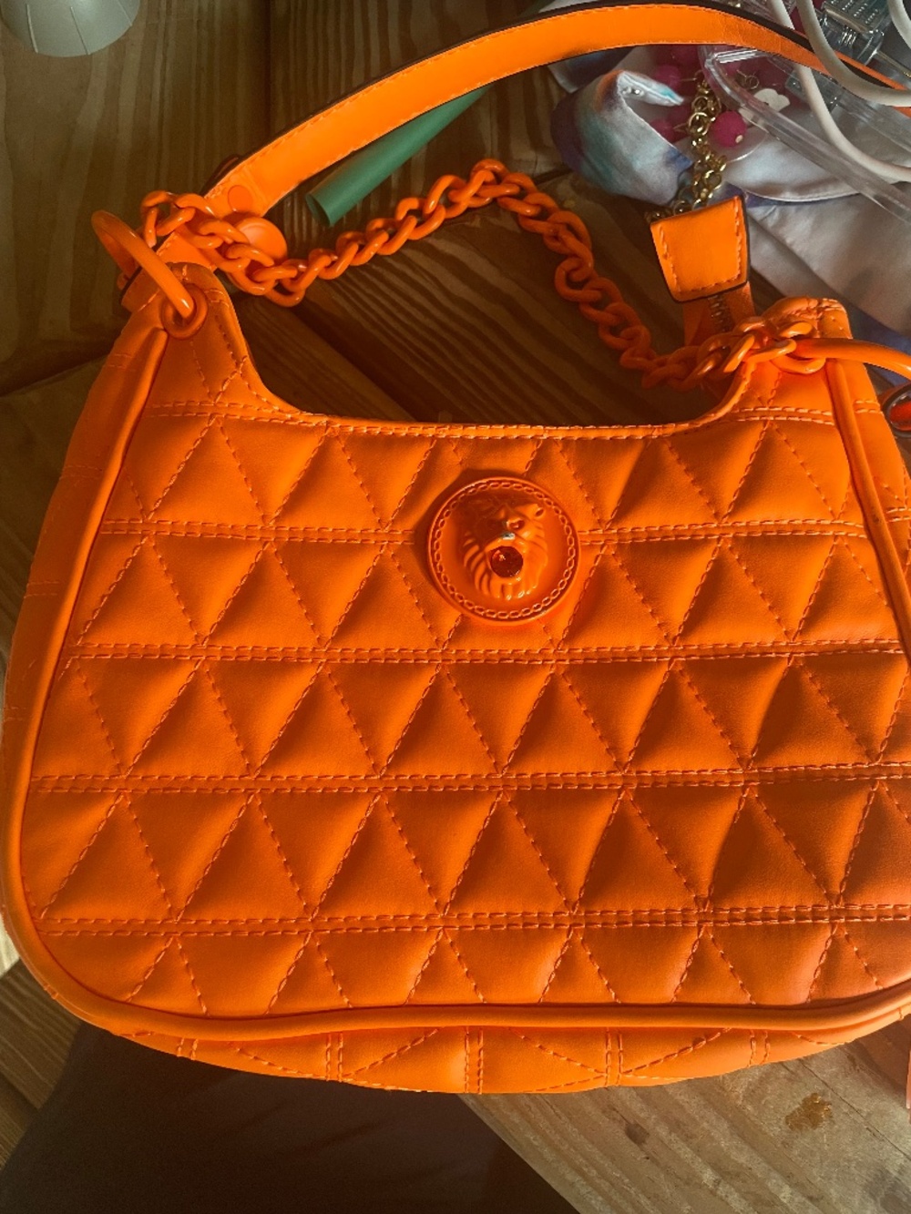 Vibrant Aldo Leona’s Quilted shoulder bag in  Vibrant orange lion head hardware